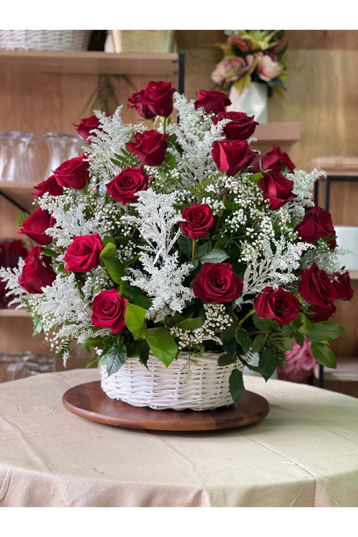 Luxurious rose basket arrangement showcasing premium roses in a timeless design, handcrafted by a Brooklyn florist for special moments.