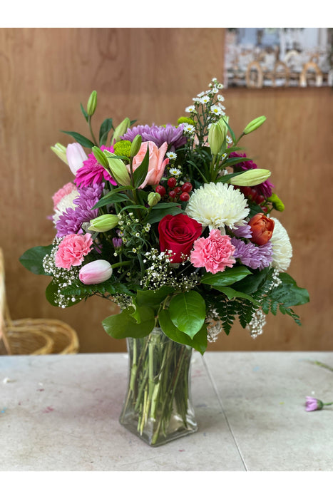 Cheerful mixed flower arrangement featuring vibrant seasonal blooms, handcrafted by a Brooklyn florist for any joyful occasion.