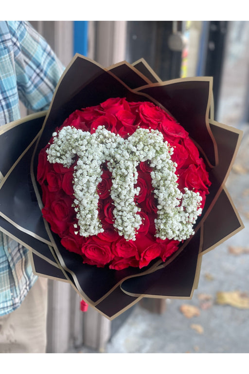 Elegant rose bouquet with a custom letter centerpiece, crafted by a Brooklyn florist for special occasions or heartfelt gifts.